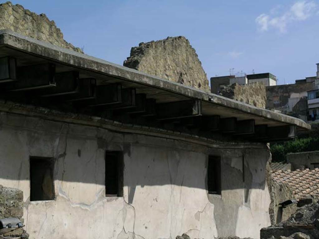 III,11 Herculaneum, May 2005. Looking towards upper floor and detail of balcony. Photo courtesy of Nicolas Monteix.